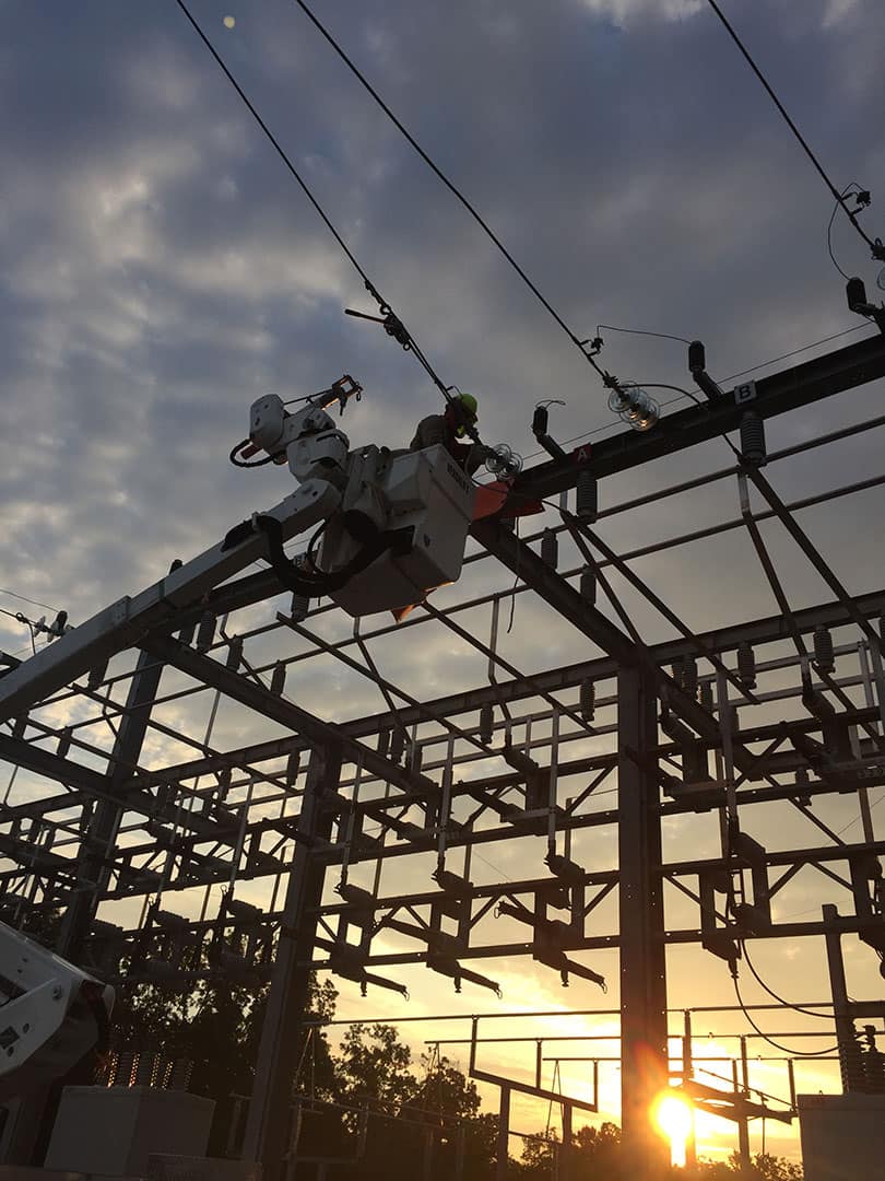 Duck River Electric technician working on a power station