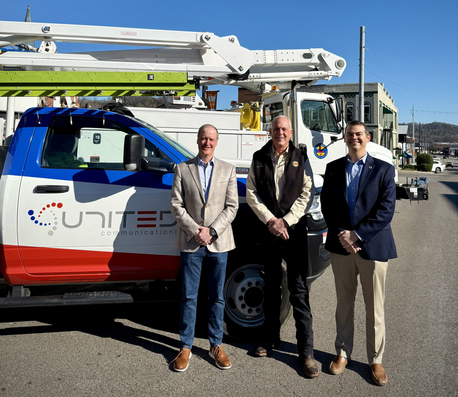 United Communications' William Bradford, DREMC Board Director Will Wilson, and DREMC President and CEO James Wright