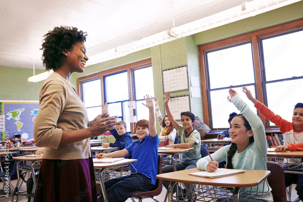 AdobeStock_562124636_Preview teacher with students in a classroom, stock image